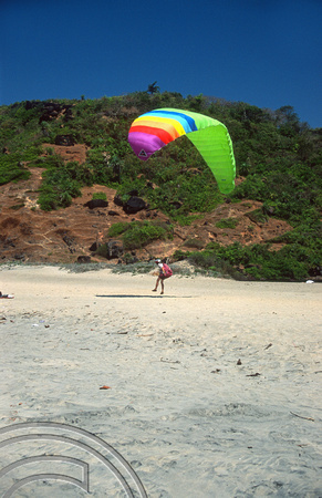T9463. Paragliders landing on little beach. Arambol. Goa. India. 4th February 2000