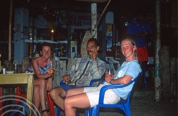 T9469. A drink on the beach. Arambol. Goa. India. 4th February 2000