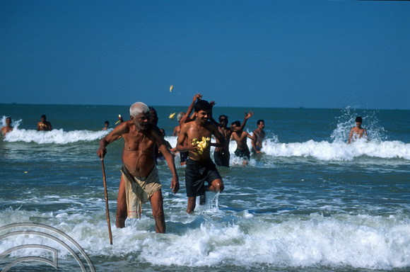 T9499. Elderly Brahmin coming out of the sea. Arambol. Goa. India. 5th February 2000