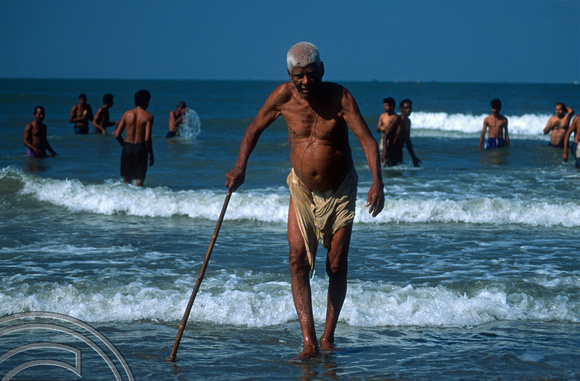 T9496. Elderly Brahmin coming out of the sea. Arambol. Goa. India. 5th February 2000