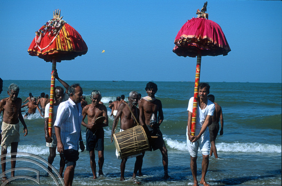 T9495. Taking the God for a swim.  An idol. Arambol. Goa. India. 5th February 2000