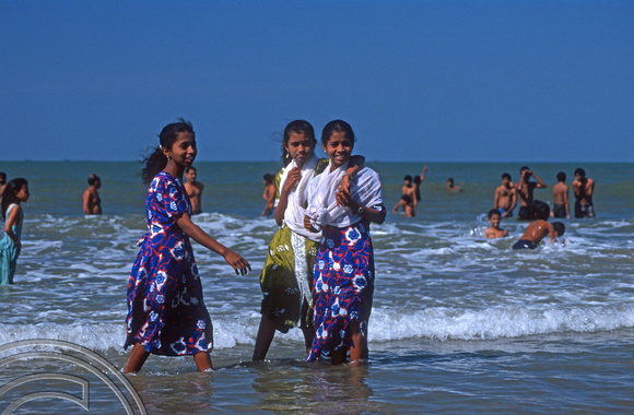 T9513. Girls bathing at the festival. Arambol. Goa. India. 5th February 2000
