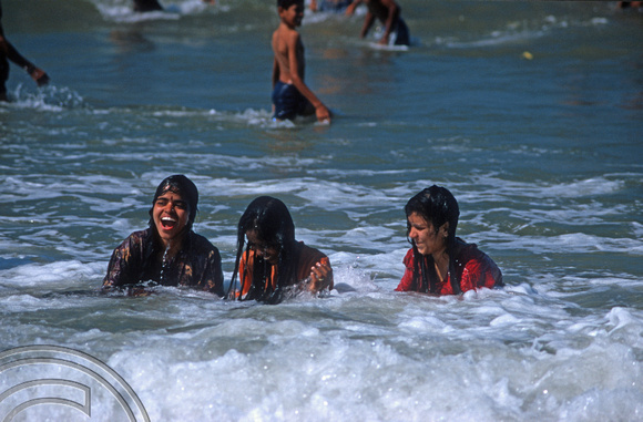 T9519. Girls bathing at the festival. Arambol. Goa. India. 5th February 2000