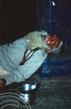 T9753. Sleeping Sadhu at the station. Ahmedabad. Gujarat. India. 16th February 2000