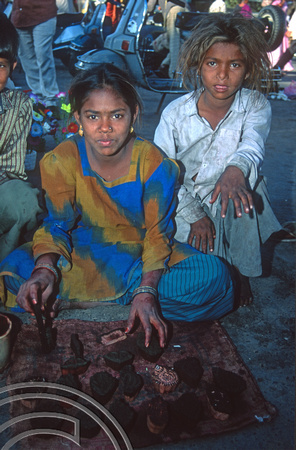 T9762. Girls painting henna designs on hands. Ahmedabad. Gujarat. India. 16th February 2000