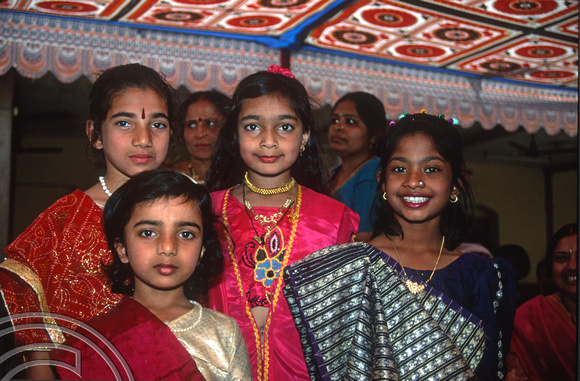 T9787. Girls at a wedding procession. Bhavnagar. Gujarat. India. 19th February 2000