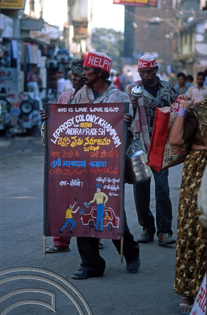 T9814. Lepers with banner collecting alms. Bhavnagar. Gujarat. India. 19th February 2000