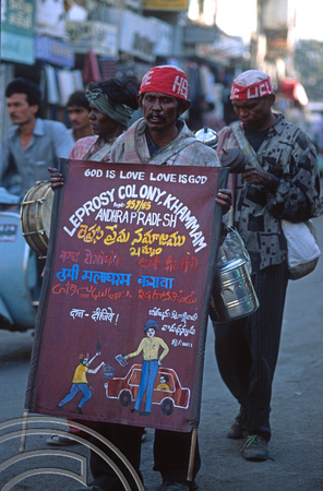 T9816. Lepers with banner collecting alms. Bhavnagar. Gujarat. India. 19th February 2000