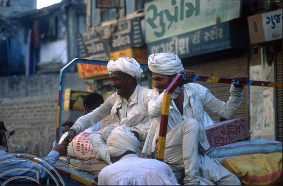 T9818. Men in local dress atop a trishaw. Bhavnagar. Gujarat. India. 19th February 2000