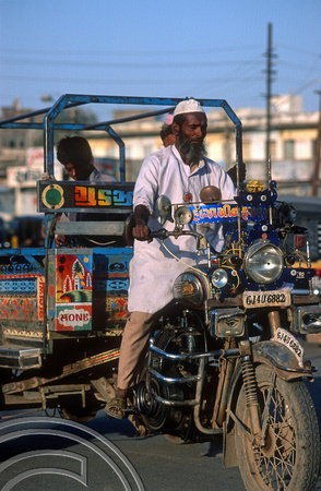 T9821. Man driving a trishaw. Bhavnagar. Gujarat. India. 19th February 2000