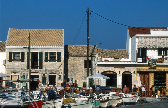 T10207. restaurants and boats on the quayside. Loggos. Paxos. Ionian Isles. Greece. 28th September 2000