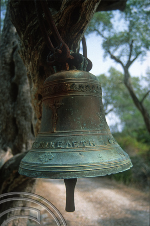 T10215. Church bell hung in a tree. Paxos. Ionian Isles. Greece. 1st October 2000