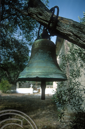 T10216. Church bell hung in a tree. Paxos. Ionian Isles. Greece. 1st October 2000