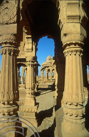T4313. Looking through pillars. Bada Bagh. Jaisalmer. Rajasthan. India. December 1993.