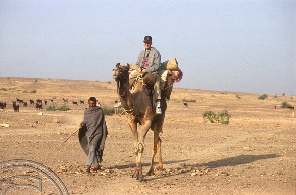 T4355. Riding a camel. Thar desert. Rajasthan. India. December 1993.