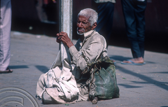 T4399. Beggar at a railway station. Rajasthan. India. December 1993.