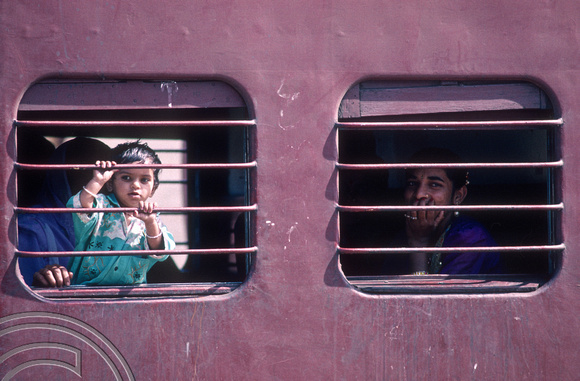 T4400. Passengers looking out of a train. Rajasthan. India. December 1993.