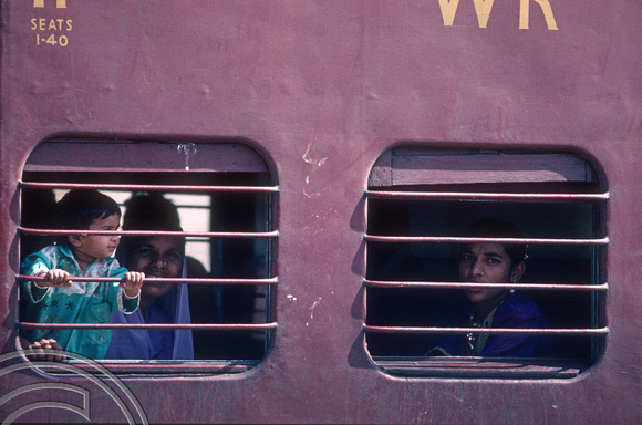 T4401. Passengers looking out of a train. Rajasthan. India. December 1993.