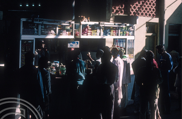 T4409. Crowding around a tea stall. Murgao. Goa. India. December 1993.