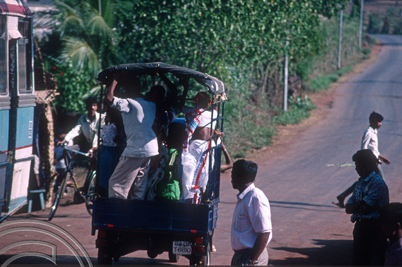 T4417. Crowding in a motor van. Arambol. Goa. India. December 1993.