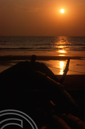 T4441. Sunset over a fishing boat. Arambol. Goa. India. December 1993.