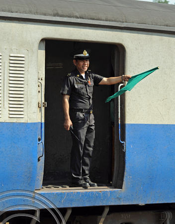 DG74221. Guard of train 52. Chiang Mai. Thailand. 11.2.11.