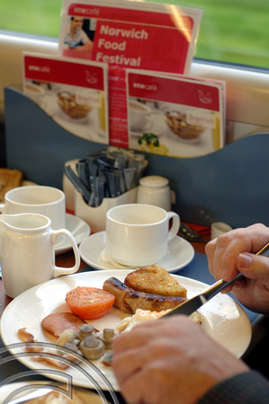 DG07948. Breakfast on the train. Norwich. 17.10.06.
