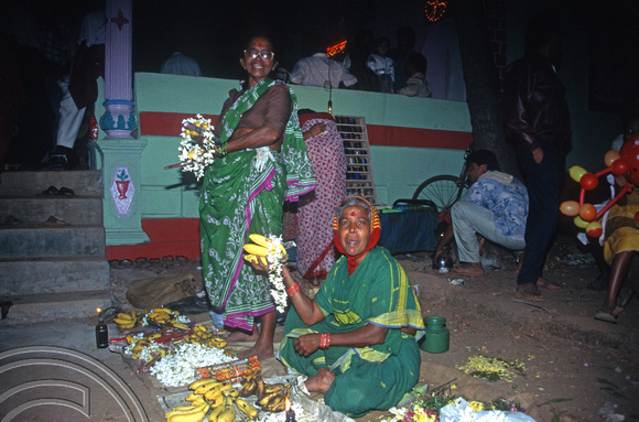 T5675. Selling offerings at a temple festival. Arambol. Goa. India. December 1995