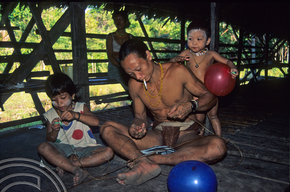 T3817. Weaving rattan. Siberut. Mentawai Islands. Indonesia. 1992.