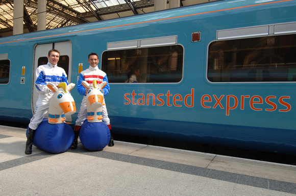 DG05971.Frankie Dettori and Philip Robinson pose for the press in front of the train. Liverpool St. 12.4.06.