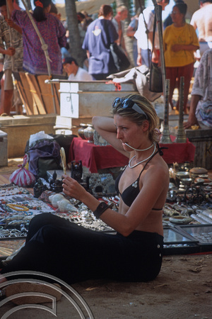 T5595. Trying on beads. The flea market. Anjuna. Goa. India. December 1995