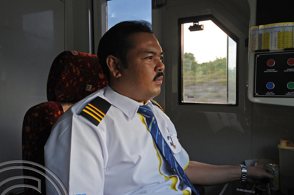 DG104022. At the controls of an ETS. Malaysia. 11.2.12.