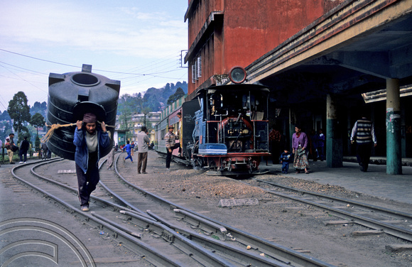 T6904. Porter and trai. Darjeeling. West Bengal. India 1998.