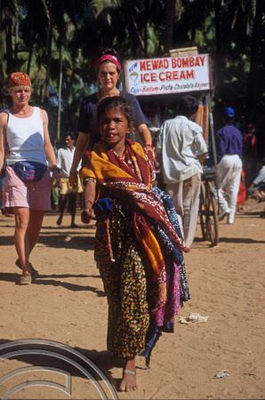 T5609. Selling sarongs. The flea market. Anjuna. Goa. India. December 1995