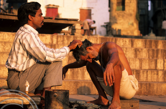 T6855. Barber at the Ghats. Varanasi. Uttar Pradesh. India. 1998.