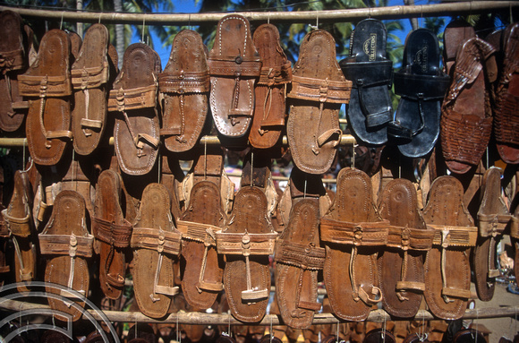 T5573. Selling sandals. The flea market. Anjuna. Goa. India. December 1995
