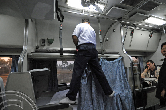FDG11172. Making the bed on the sleeper to Butterworth. Thailand. 26.1.09.